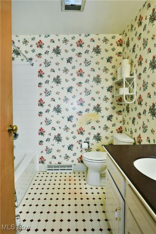 2741 Citadel Dr NE, Warren, OH 44483 - bathroom featuring wallpapered walls and vanity
