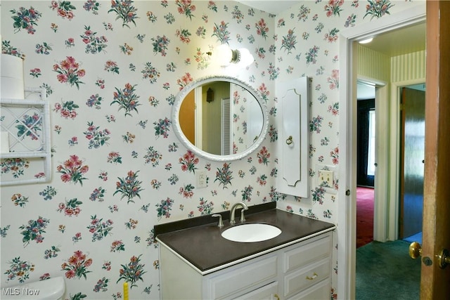 2741 Citadel Dr NE, Warren, OH 44483 - bathroom featuring wallpapered walls and vanity
