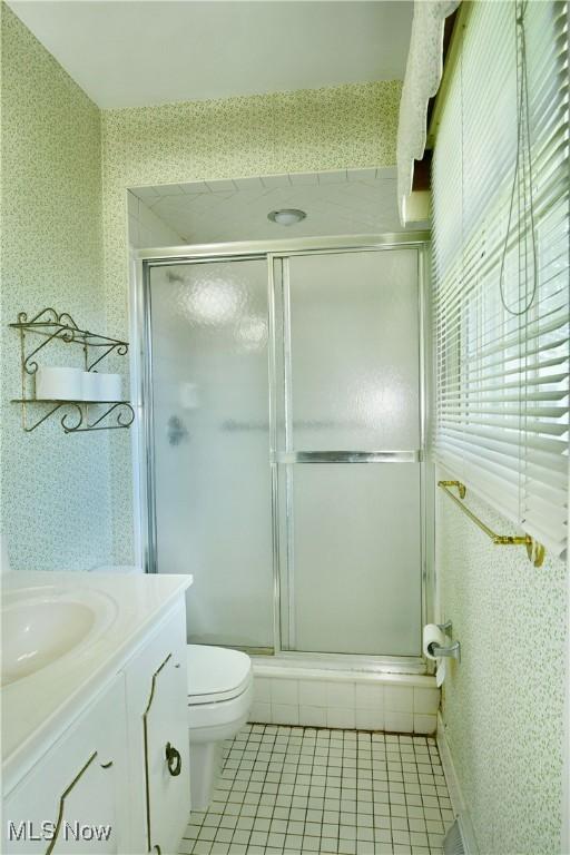 2741 Citadel Dr NE, Warren, OH 44483 - full bath with a shower stall, vanity, tile patterned flooring, and wallpapered walls
