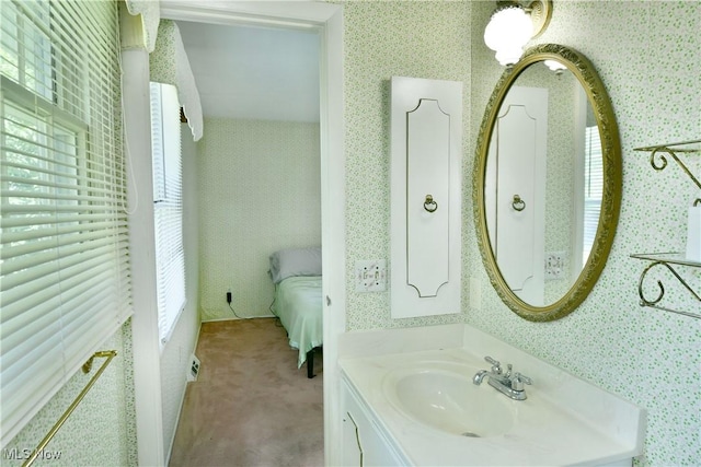 2741 Citadel Dr NE, Warren, OH 44483 - ensuite bathroom featuring vanity, healthy amount of natural light, and wallpapered walls