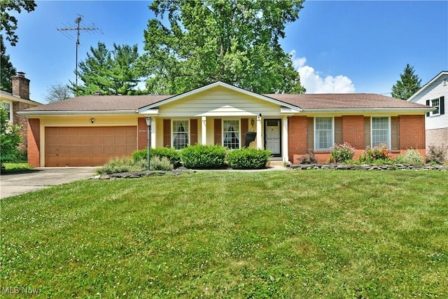 2741 Citadel Dr NE, Warren, OH 44483 - ranch-style home with an attached garage, driveway, brick siding, a front lawn, and a porch