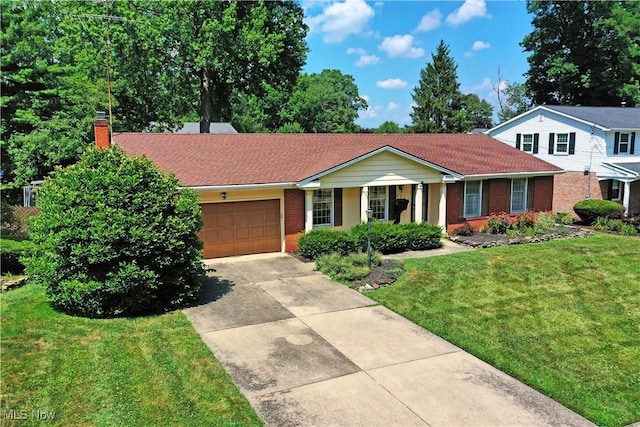 2741 Citadel Dr NE, Warren, OH 44483 - single story home featuring brick siding, concrete driveway, a front lawn, a garage, and a chimney