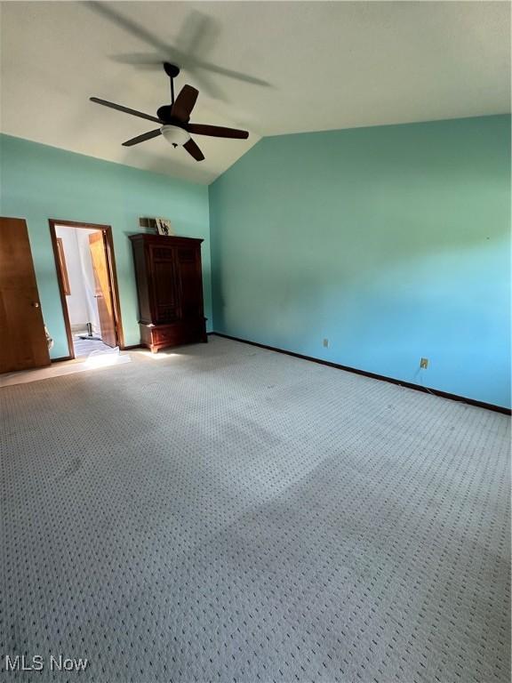 6279 Palmer Dr NW, Canton, OH 44718 - unfurnished bedroom featuring lofted ceiling, carpet, and ceiling fan
