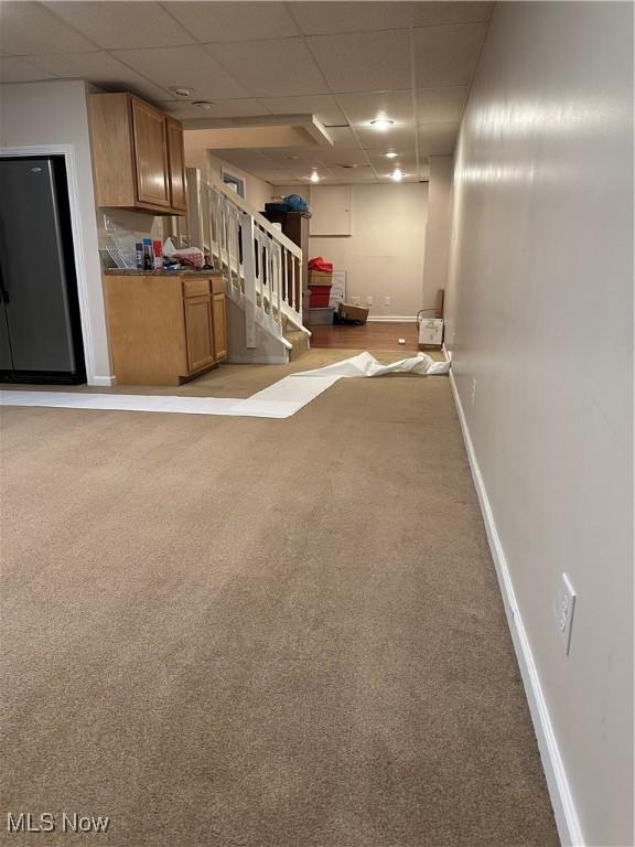 6279 Palmer Dr NW, Canton, OH 44718 - finished basement with stairway, light carpet, and a paneled ceiling