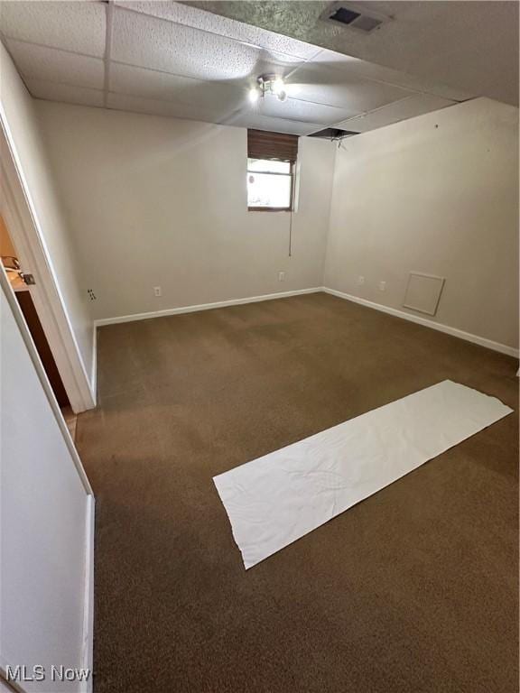 6279 Palmer Dr NW, Canton, OH 44718 - carpeted spare room with baseboards and a paneled ceiling