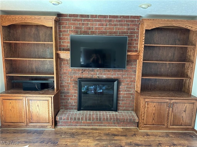 6279 Palmer Dr NW, Canton, OH 44718 - unfurnished living room with wood finished floors and a fireplace