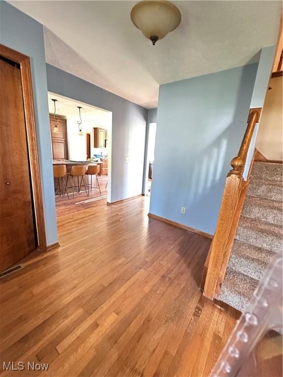 6279 Palmer Dr NW, Canton, OH 44718 - living room featuring wood finished floors and stairway