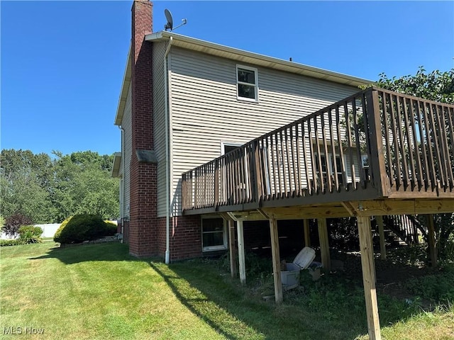 6279 Palmer Dr NW, Canton, OH 44718 - back of house featuring a deck, a lawn, and a chimney