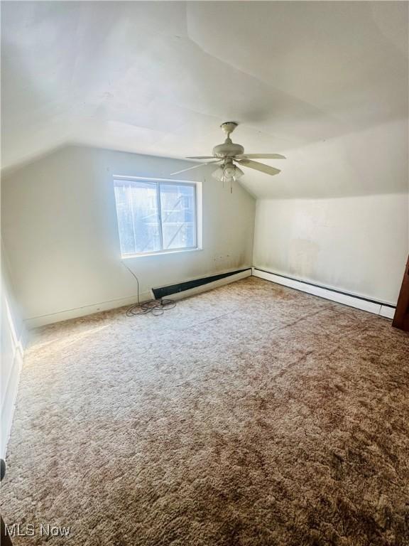 668 Virginia Ave, Follansbee, WV 26037 - additional living space featuring lofted ceiling, a ceiling fan, carpet flooring, and baseboard heating