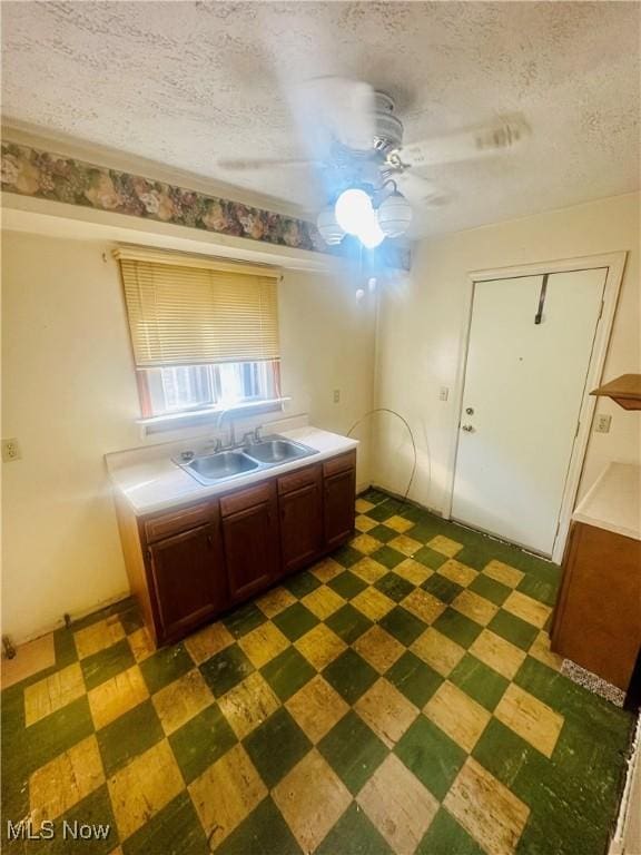 668 Virginia Ave, Follansbee, WV 26037 - kitchen with dark flooring, ceiling fan, a textured ceiling, and light countertops