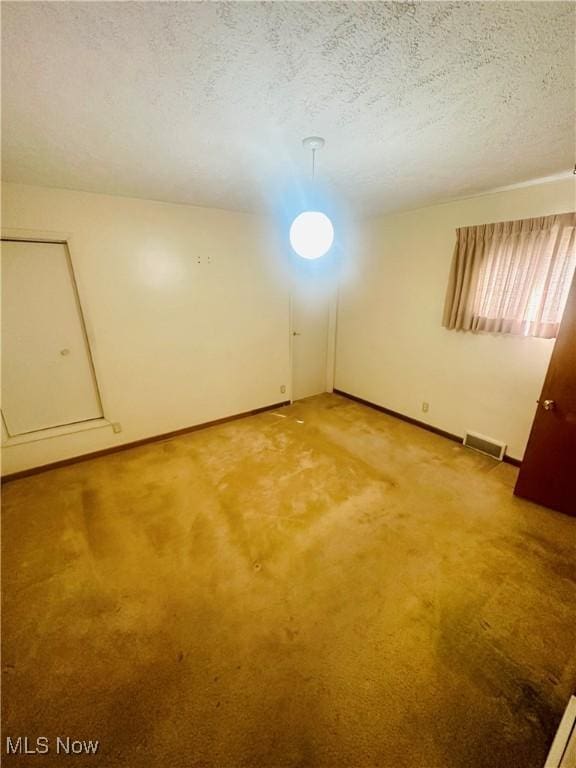 668 Virginia Ave, Follansbee, WV 26037 - empty room with light carpet and a textured ceiling