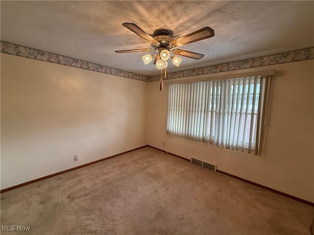 668 Virginia Ave, Follansbee, WV 26037 - carpeted empty room featuring ceiling fan and a textured ceiling