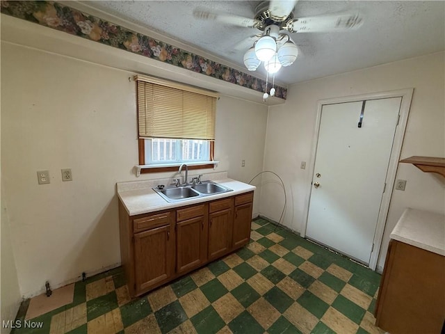 668 Virginia Ave, Follansbee, WV 26037 - kitchen featuring a ceiling fan, dark flooring, light countertops, and a textured ceiling