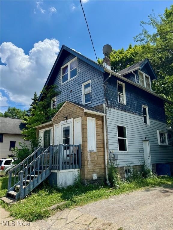 864 Delia Ave, Akron, OH 44320 - view of front of property with a chimney