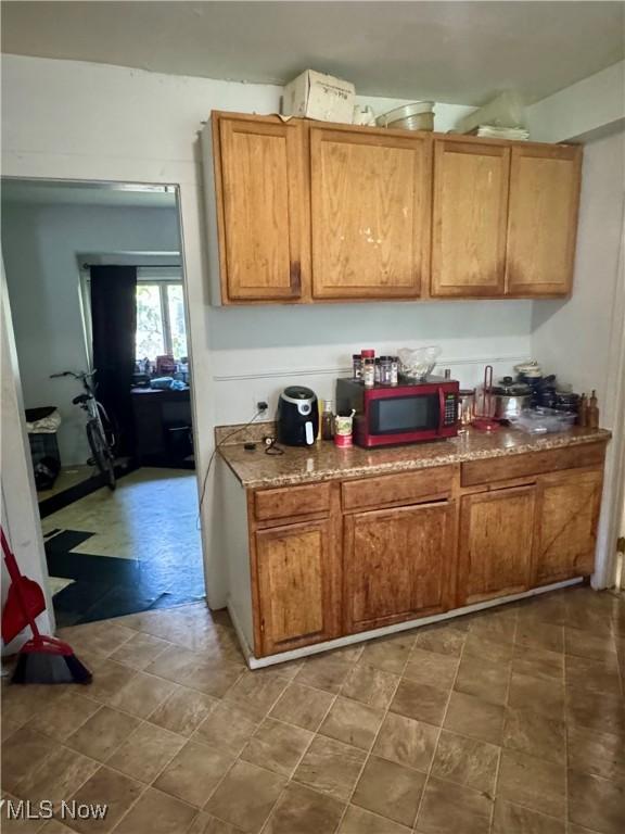 864 Delia Ave, Akron, OH 44320 - kitchen with brown cabinets
