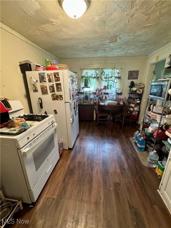 526 Madison Ave, Akron, OH 44320 - kitchen featuring white appliances, dark wood-type flooring, and crown molding
