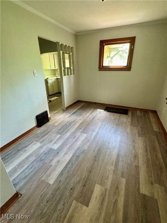 348 Jewell Dr, Akron, OH 44311 - spare room with wood finished floors and crown molding