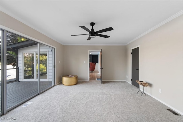 3350 S Main St, Akron, OH 44319 - carpeted spare room with a ceiling fan and ornamental molding