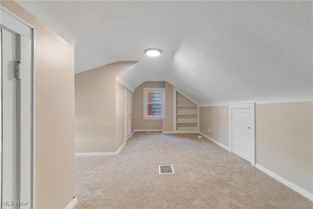 3350 S Main St, Akron, OH 44319 - bonus room featuring built in features, light colored carpet, and lofted ceiling