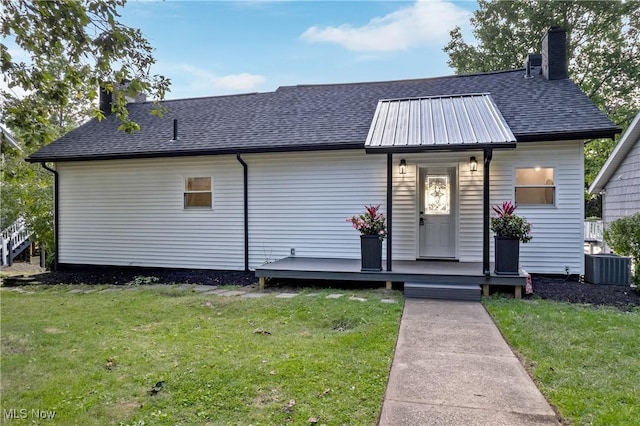 3350 S Main St, Akron, OH 44319 - view of front facade featuring a front lawn, a chimney, and roof with shingles