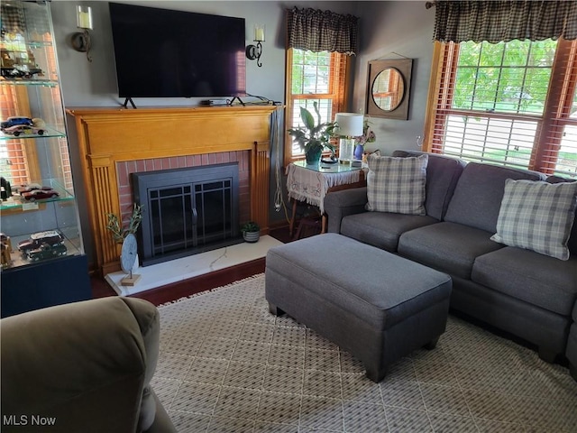 4626 7th St SW, Canton, OH 44708 - living area featuring plenty of natural light, a brick fireplace, and wood finished floors