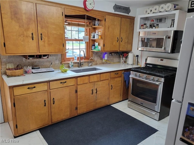4626 7th St SW, Canton, OH 44708 - kitchen with open shelves, light marble finish floors, stainless steel appliances, backsplash, and light countertops