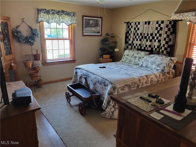 4626 7th St SW, Canton, OH 44708 - carpeted bedroom featuring baseboards and wood finished floors