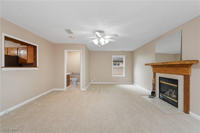3139 Prior Dr, Cuyahoga Falls, OH 44223 - unfurnished living room featuring light colored carpet, a ceiling fan, and a tiled fireplace