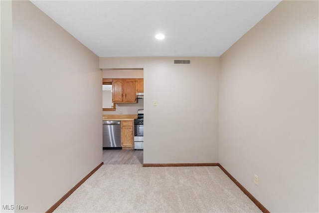 3139 Prior Dr, Cuyahoga Falls, OH 44223 - unfurnished living room featuring light carpet and recessed lighting