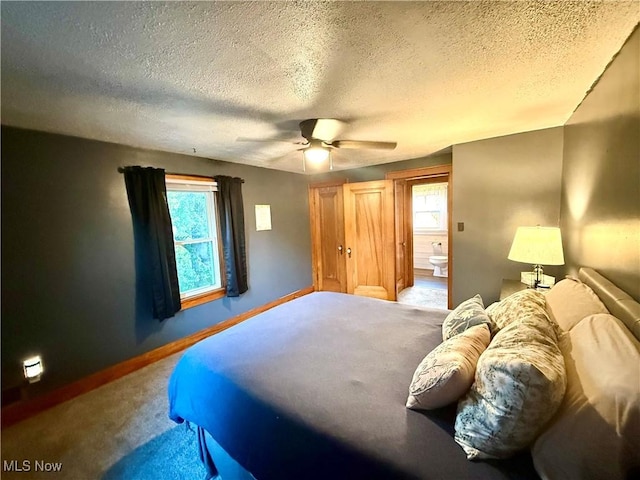 1257 Elmhurst Dr, Weirton, WV 26062 - bedroom featuring carpet flooring, a textured ceiling, a ceiling fan, and connected bathroom