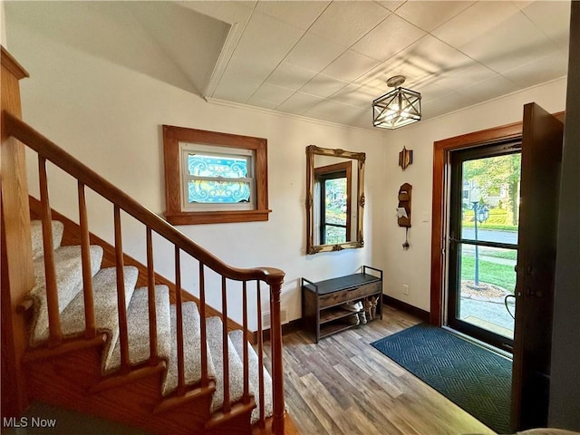 1257 Elmhurst Dr, Weirton, WV 26062 - entrance foyer featuring wood finished floors, stairs, and crown molding