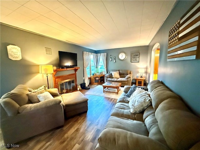 1257 Elmhurst Dr, Weirton, WV 26062 - living area featuring arched walkways, wood finished floors, and a fireplace