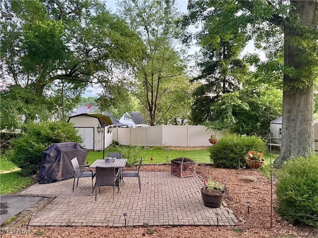 1257 Elmhurst Dr, Weirton, WV 26062 - view of patio featuring a storage unit, outdoor dining space, and area for grilling