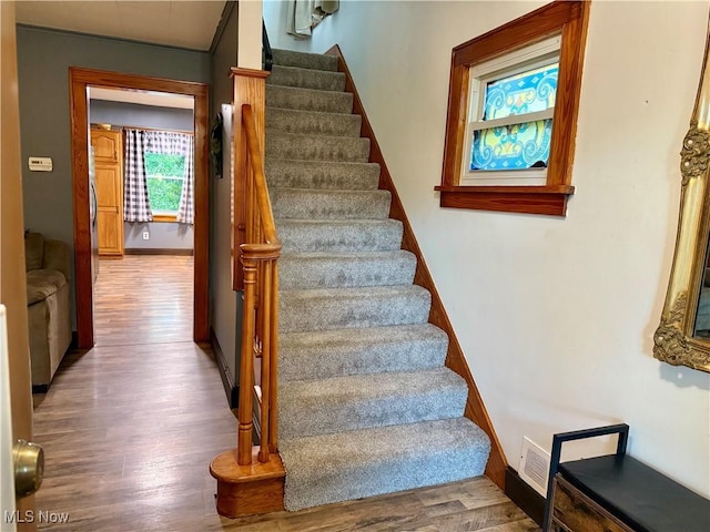 1257 Elmhurst Dr, Weirton, WV 26062 - stairs featuring wood finished floors and baseboards