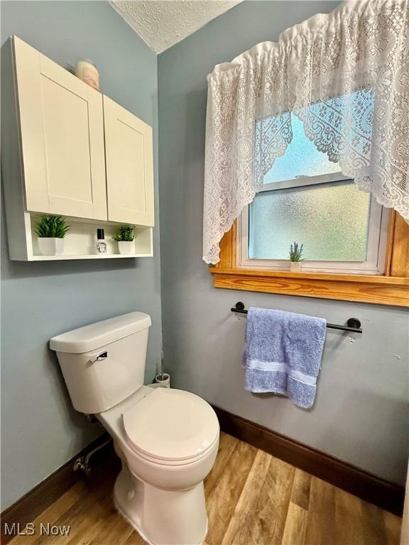 1257 Elmhurst Dr, Weirton, WV 26062 - half bath featuring wood finished floors and a textured ceiling