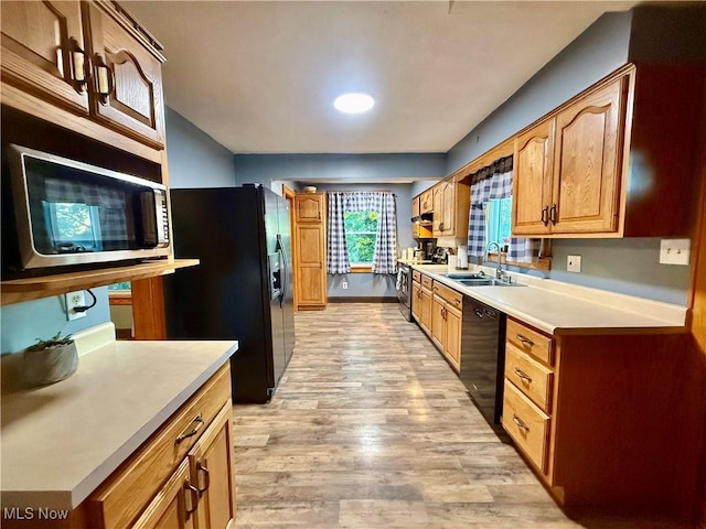 1257 Elmhurst Dr, Weirton, WV 26062 - kitchen with black appliances, light countertops, and light wood-style floors