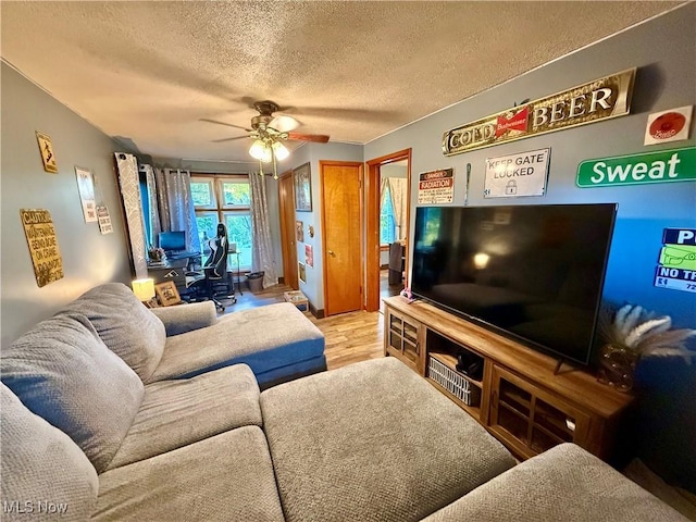 1257 Elmhurst Dr, Weirton, WV 26062 - living area with wood finished floors, ceiling fan, and a textured ceiling
