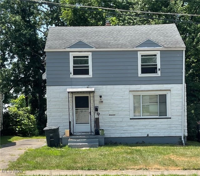 472 Keck St, Akron, OH 44305 - traditional-style house with stone siding, a shingled roof, and a front lawn