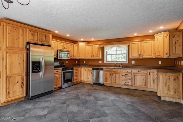 200 Breezy Acres Ln, Walker, WV 26180 - kitchen with stainless steel appliances, a textured ceiling, recessed lighting, light brown cabinets, and dark countertops