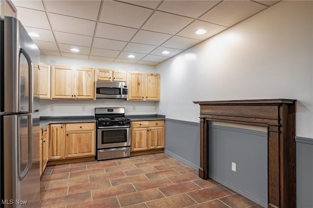 200 Breezy Acres Ln, Walker, WV 26180 - kitchen featuring stainless steel appliances, dark countertops, light brown cabinetry, a drop ceiling, and recessed lighting