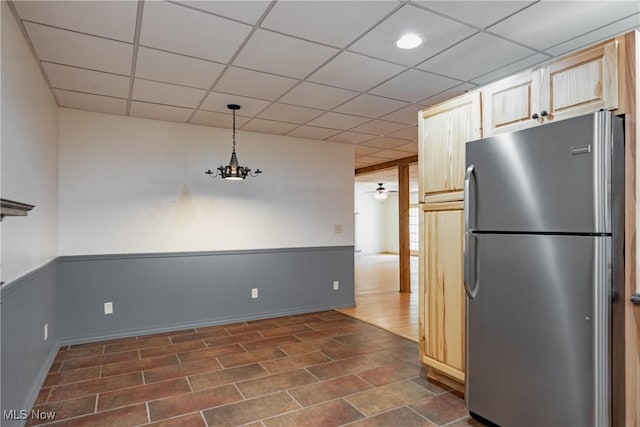 200 Breezy Acres Ln, Walker, WV 26180 - kitchen featuring freestanding refrigerator, a paneled ceiling, ceiling fan, and pendant lighting