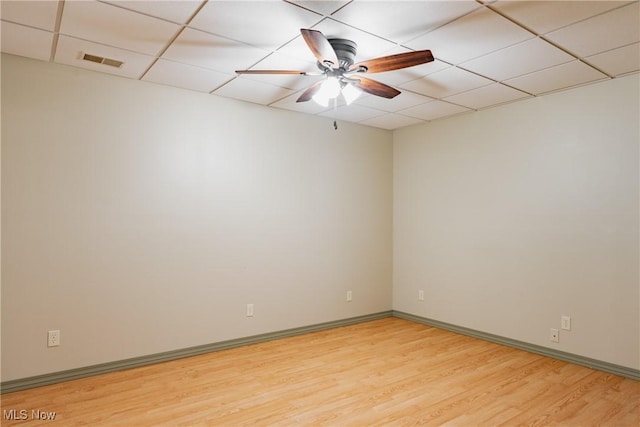 200 Breezy Acres Ln, Walker, WV 26180 - spare room with a paneled ceiling, ceiling fan, and light wood-style flooring
