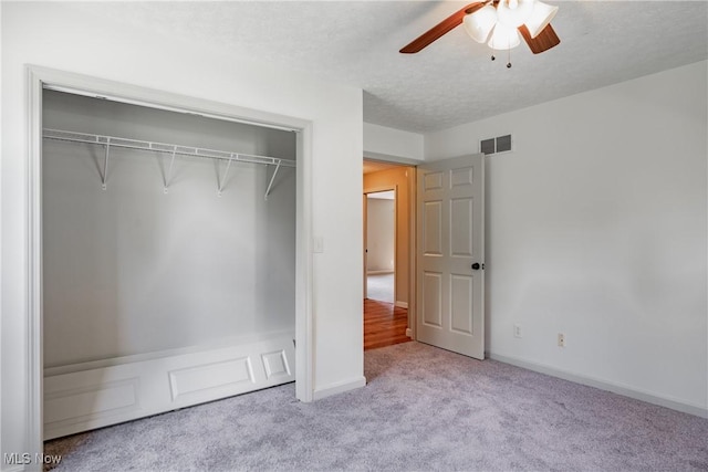 200 Breezy Acres Ln, Walker, WV 26180 - unfurnished bedroom featuring carpet, a closet, ceiling fan, and a textured ceiling