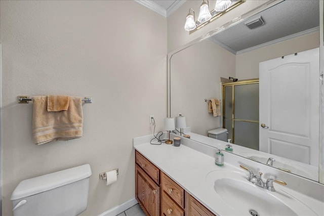 bathroom featuring vanity, a shower with shower door, ornamental molding, and toilet