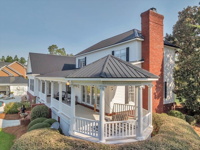 rear view of house with a porch