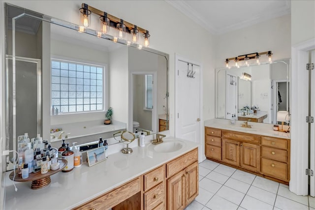 bathroom with tile patterned floors, vanity, crown molding, and toilet