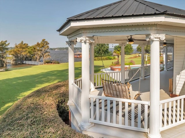 view of patio with a water view and a gazebo