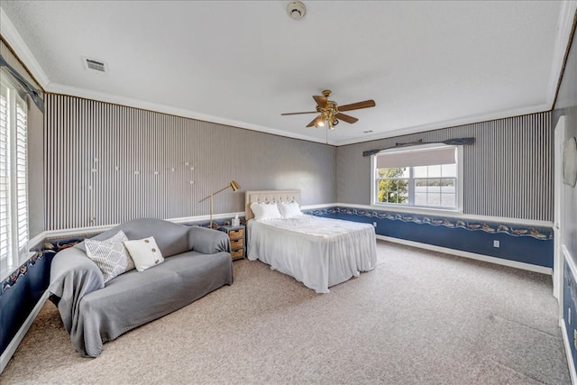 bedroom featuring crown molding, multiple windows, carpet flooring, and ceiling fan