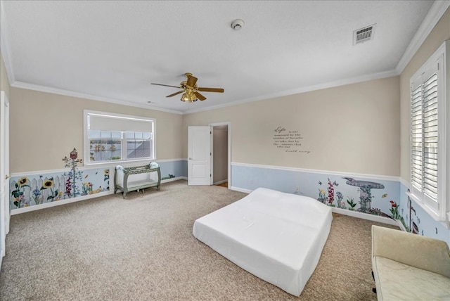 bedroom featuring carpet, ceiling fan, and ornamental molding