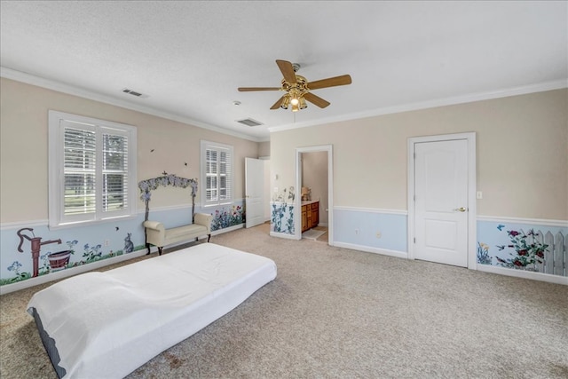 bedroom featuring crown molding, ensuite bathroom, and ceiling fan